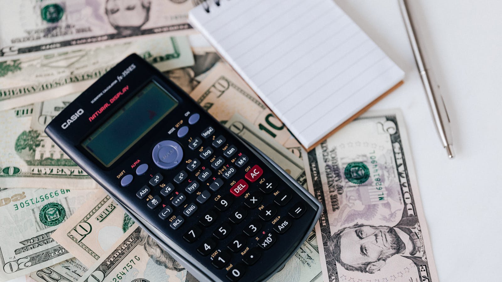 Calculator and financial documents on a desk